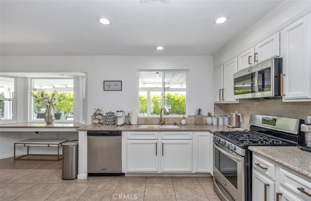 2230 North Volturno Road Palm Springs, CA 92262 - Photo 10 of 34 a kitchen with a sink stove and microwave