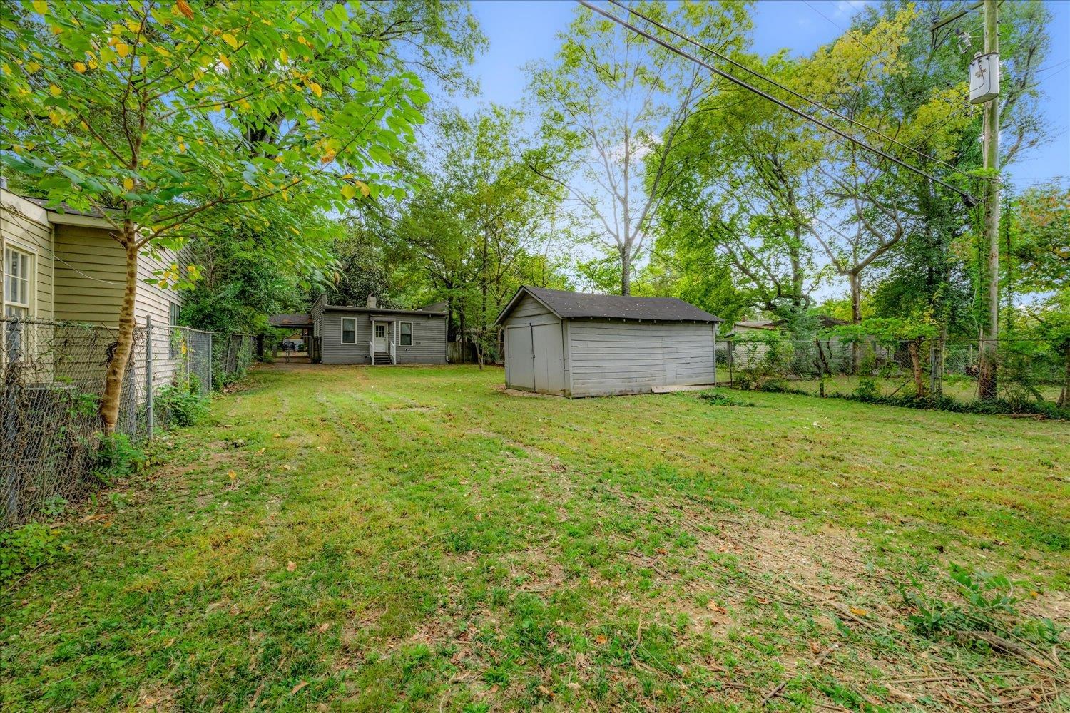 431 Alexander Street Memphis, TN 38111 - Photo 13 of 13 Fenced backyard with a storage unit