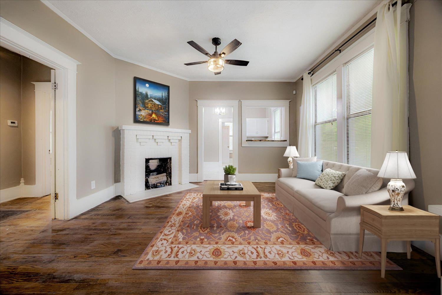 431 Alexander Street Memphis, TN 38111 - Photo 3 of 13 Living room featuring crown molding, wood finished floors, a fireplace, and ceiling fan