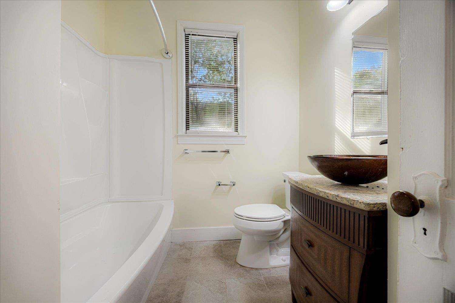 431 Alexander Street Memphis, TN 38111 - Photo 6 of 13 Bathroom featuring vanity, healthy amount of natural light, and shower combination