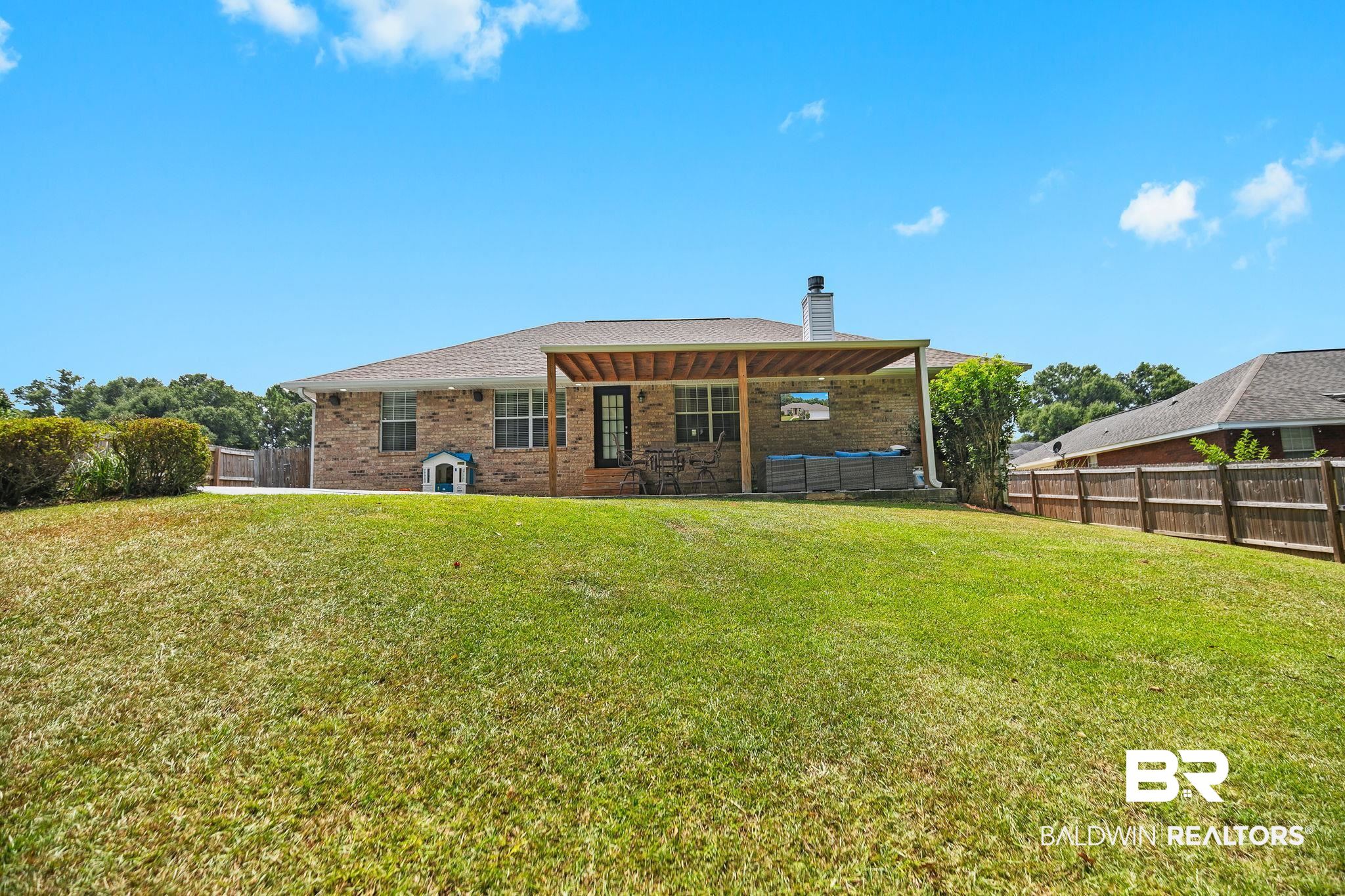28246 Turkey Branch Drive Daphne, AL 36526 - Photo 25 of 41 Rear view of property with a lawn and a patio