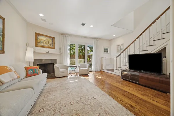 a living room with furniture and a fireplace