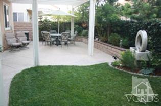4912 Borders Street Simi Valley, CA 93063 - Photo 9 of 10 a view of a patio with table and chairs and potted plants