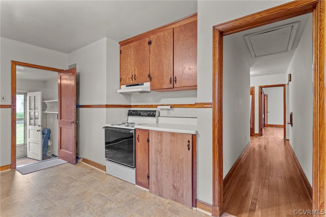 2916 Sherbourne Road North Chesterfield, VA 23237 - Photo 12 of 43 a view of a kitchen with stainless steel appliances granite countertop a stove and a refrigerator