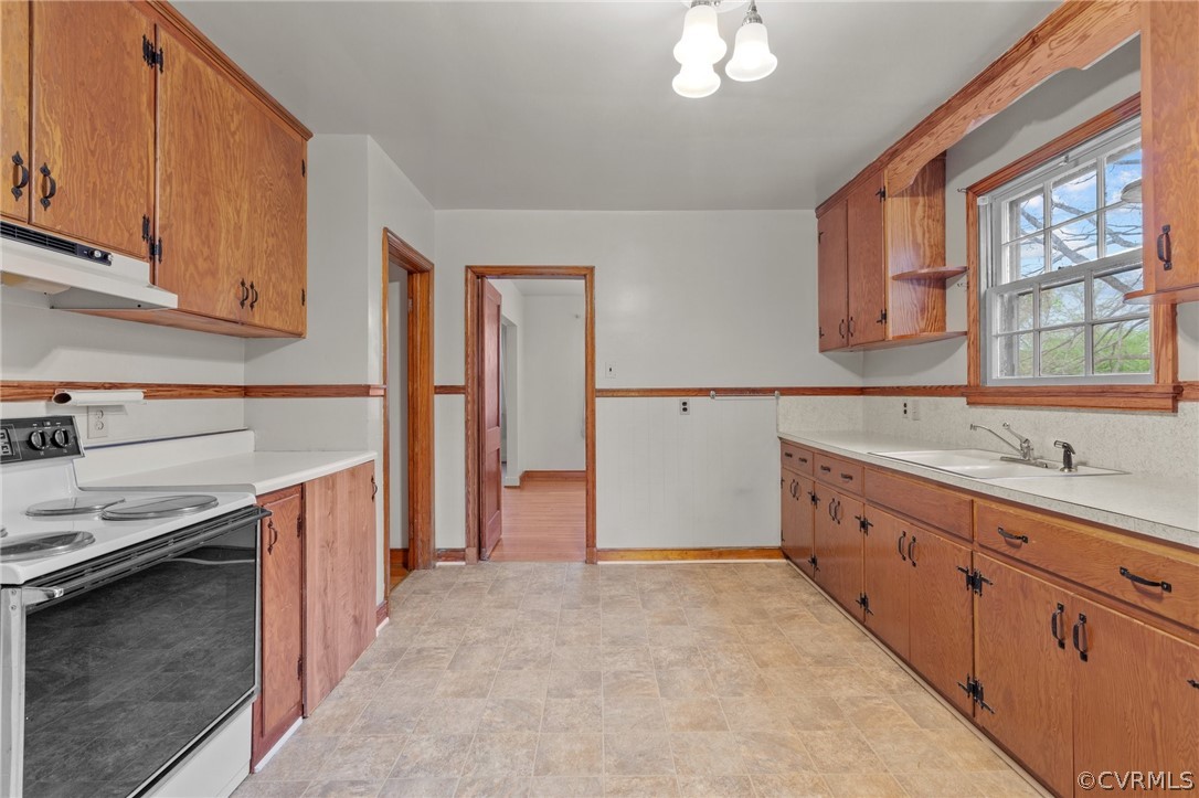 2916 Sherbourne Road North Chesterfield, VA 23237 - Photo 15 of 43 a kitchen with granite countertop a sink stainless steel appliances and cabinets