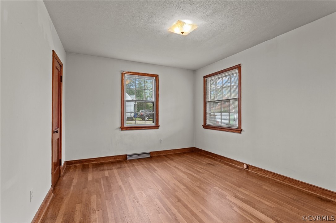 2916 Sherbourne Road North Chesterfield, VA 23237 - Photo 16 of 43 an empty room with wooden floor and windows