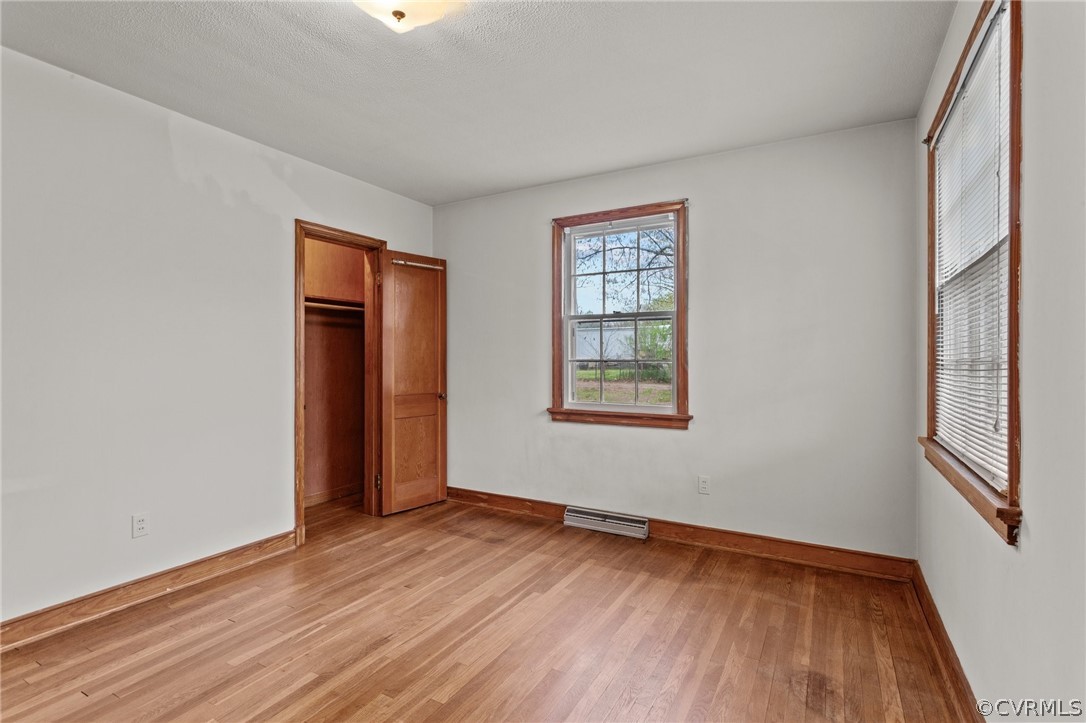 2916 Sherbourne Road North Chesterfield, VA 23237 - Photo 18 of 43 an empty room with wooden floor and windows