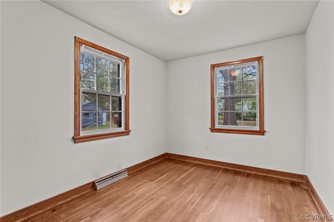 2916 Sherbourne Road North Chesterfield, VA 23237 - Photo 19 of 43 an empty room with wooden floor and windows