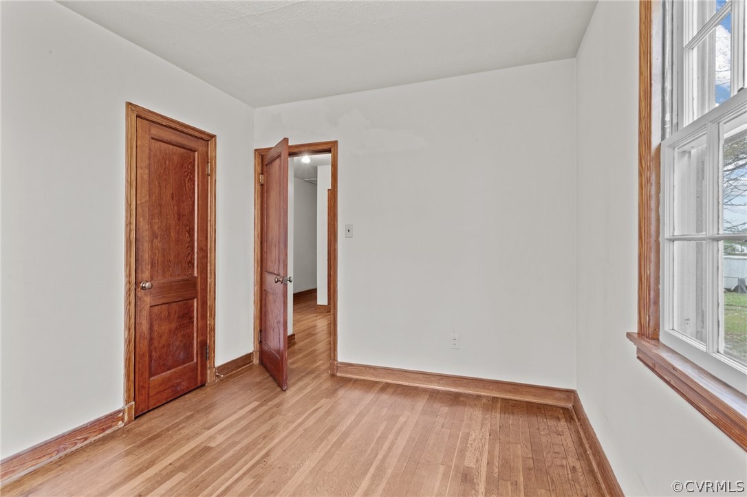2916 Sherbourne Road North Chesterfield, VA 23237 - Photo 20 of 43 an empty room with wooden floor and a window