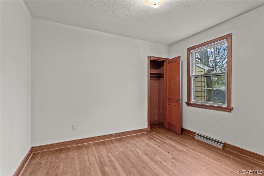 2916 Sherbourne Road North Chesterfield, VA 23237 - Photo 25 of 43 an empty room with wooden floor and windows