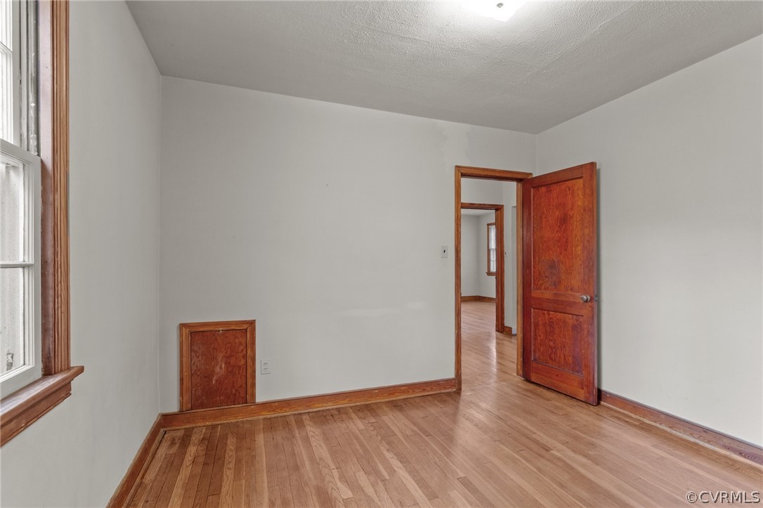 2916 Sherbourne Road North Chesterfield, VA 23237 - Photo 26 of 43 a view of an empty room with wooden floor and a window