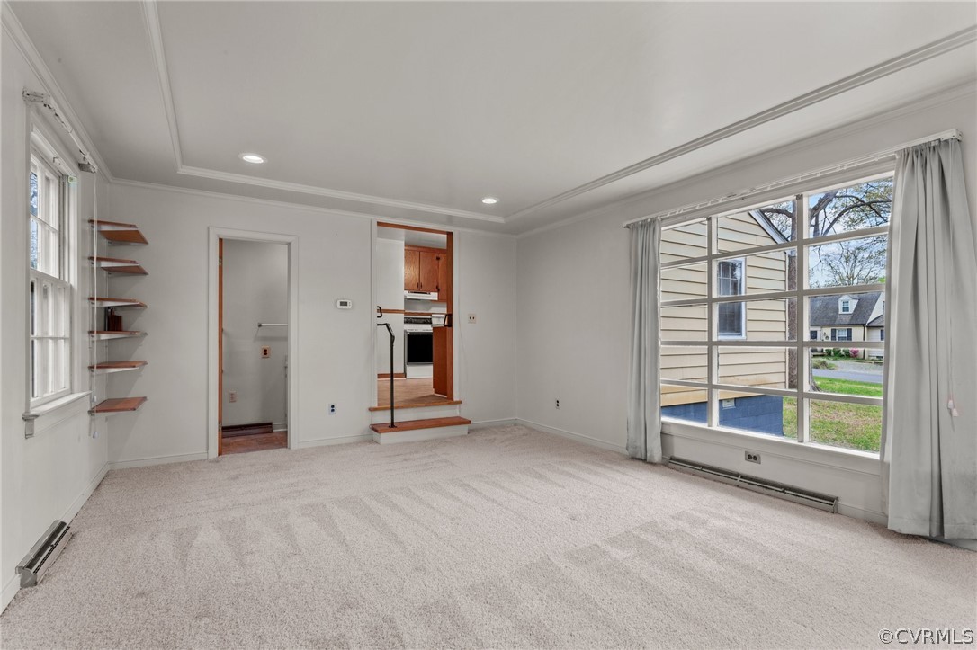 2916 Sherbourne Road North Chesterfield, VA 23237 - Photo 31 of 43 an empty room with a fireplace and exposed radiator