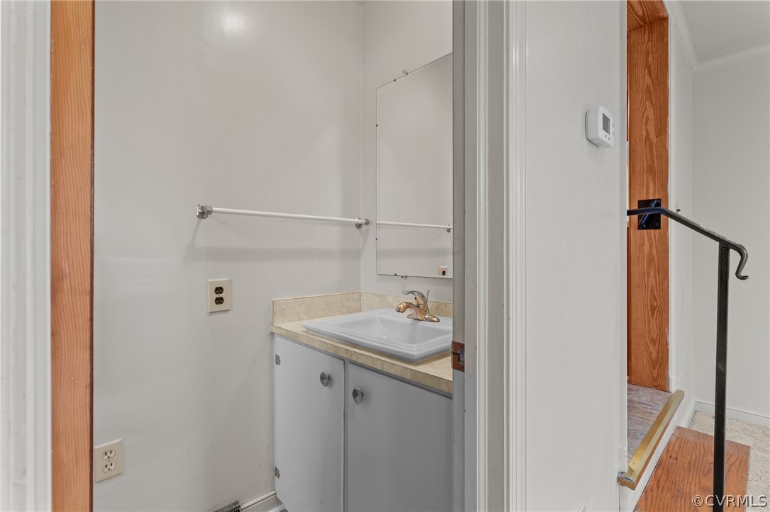 2916 Sherbourne Road North Chesterfield, VA 23237 - Photo 33 of 43 a bathroom with a sink and mirror