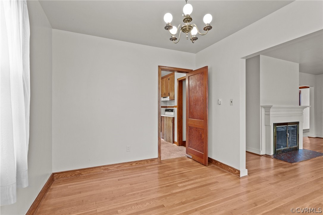 2916 Sherbourne Road North Chesterfield, VA 23237 - Photo 10 of 43 a view of an empty room with wooden floor and a fireplace