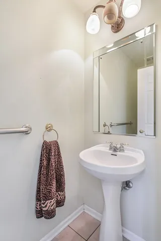 a bathroom with a sink and mirror