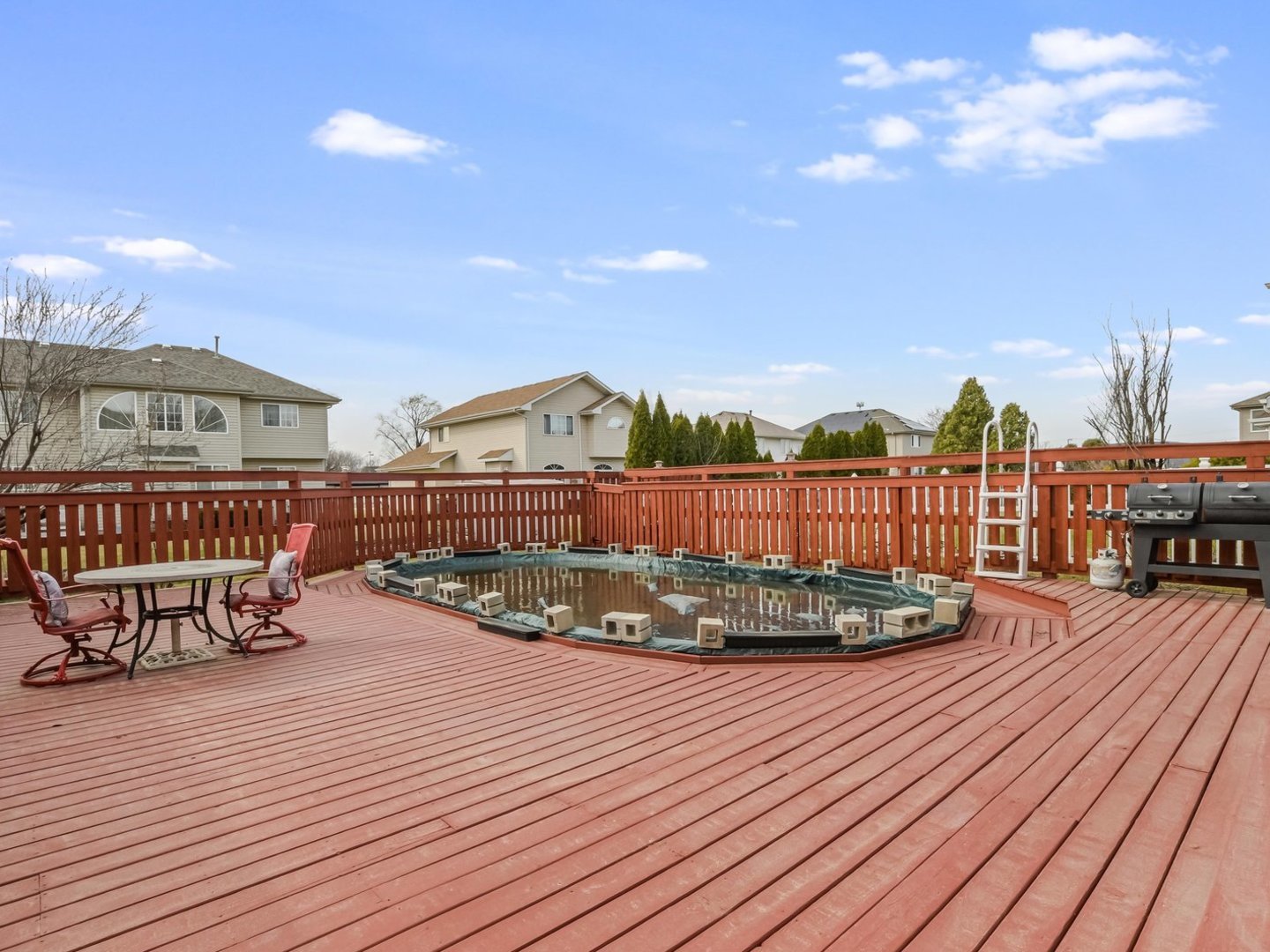 18036 Crystal Lane Lansing, IL 60438 - Photo 26 of 46 a view of a chairs and table on the wooden roof deck