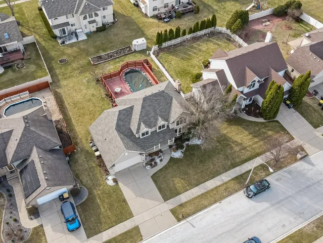 an aerial view of residential houses with outdoor space