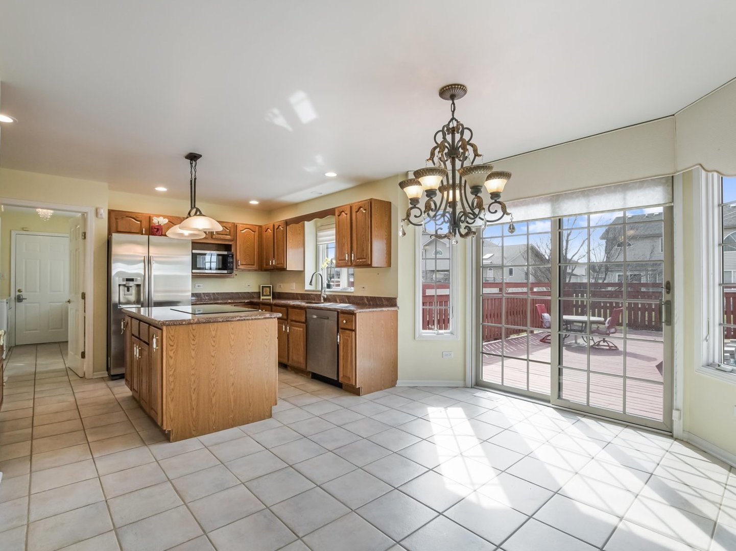 18036 Crystal Lane Lansing, IL 60438 - Photo 7 of 46 a kitchen with stainless steel appliances granite countertop a refrigerator and a stove top oven