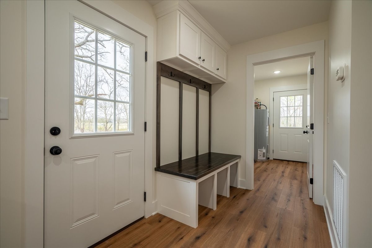 3987 Buffalo Road Summertown, TN 38483 - Photo 23 of 26 a view of a hallway with wooden floor and staircase