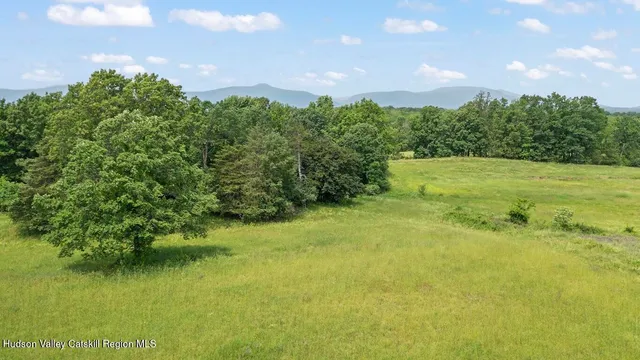 a view of a lake with a house in the background