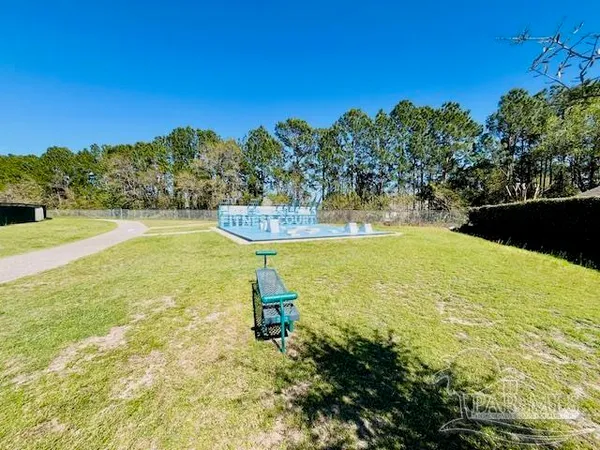 a view of a water fountain and an ocean