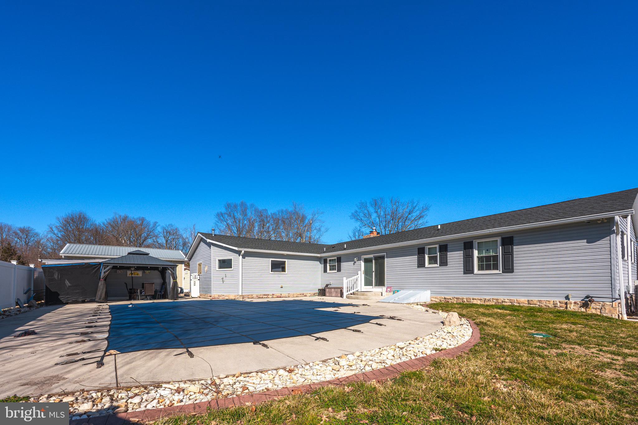 716 Paradise Road Aberdeen, MD 21001 - Photo 20 of 85 a front view of a house with a yard