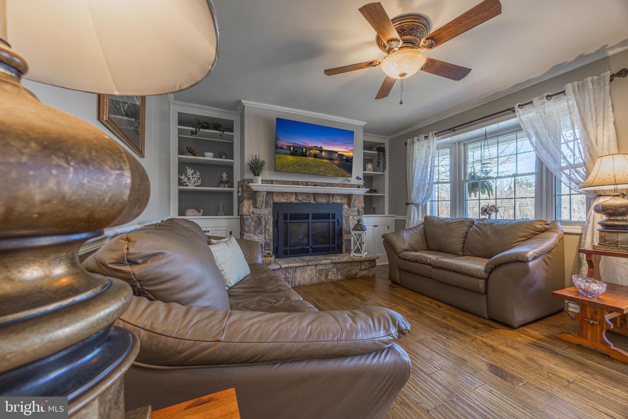 716 Paradise Road Aberdeen, MD 21001 - Photo 34 of 85 a living room with furniture and a fireplace