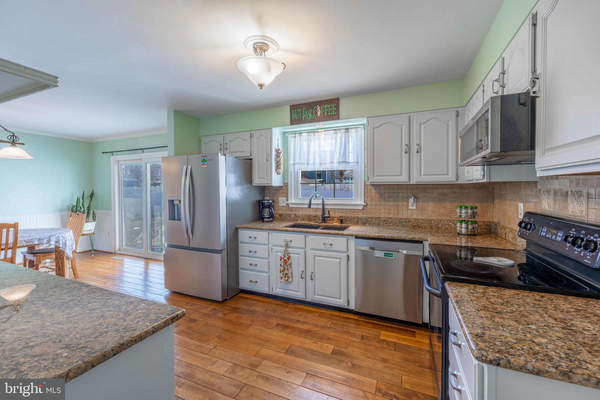 716 Paradise Road Aberdeen, MD 21001 - Photo 45 of 85 a kitchen with stainless steel appliances granite countertop a refrigerator stove microwave and sink