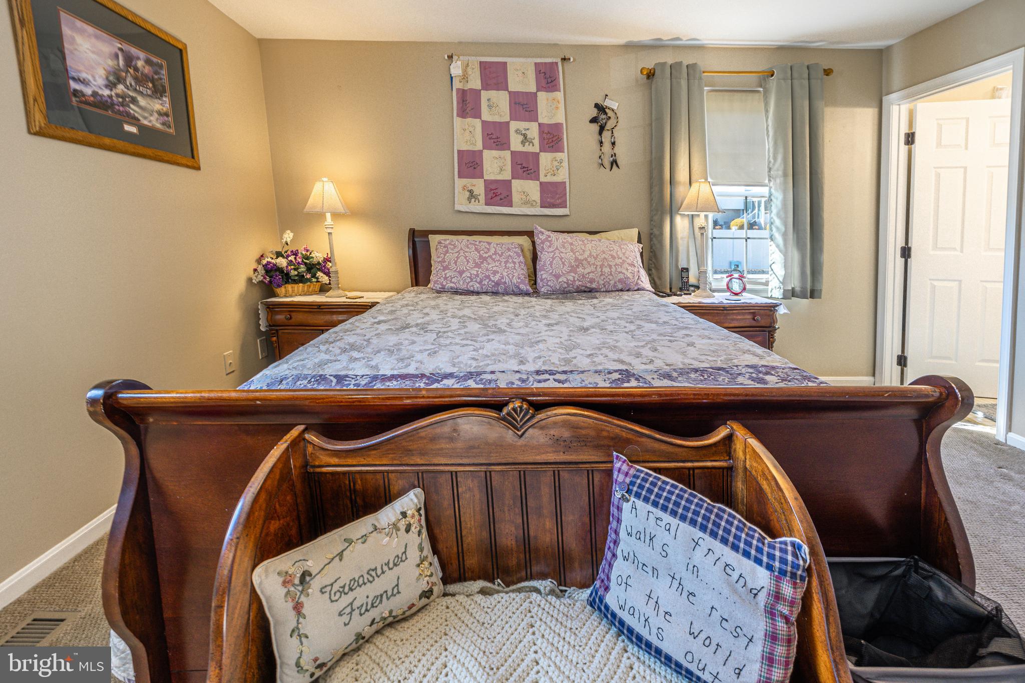 716 Paradise Road Aberdeen, MD 21001 - Photo 60 of 85 a bedroom with a bed and wooden floor