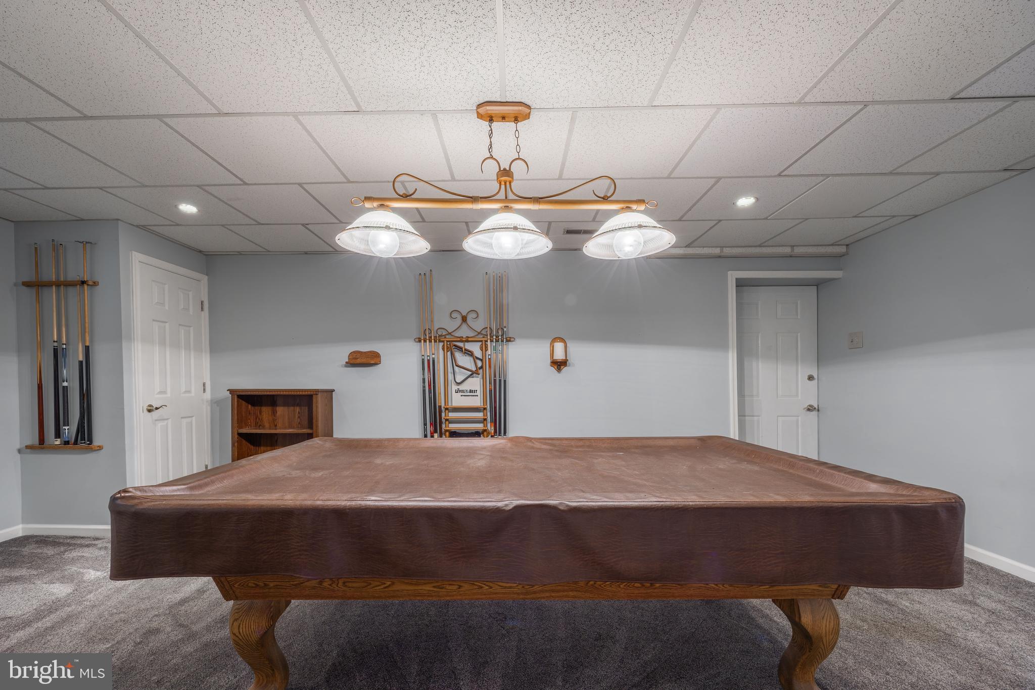 716 Paradise Road Aberdeen, MD 21001 - Photo 71 of 85 a bed room with a bed mirror and a chandelier