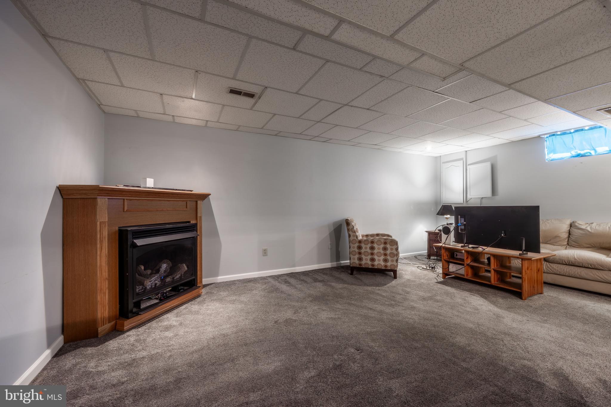 716 Paradise Road Aberdeen, MD 21001 - Photo 77 of 85 a living room with furniture and a fireplace