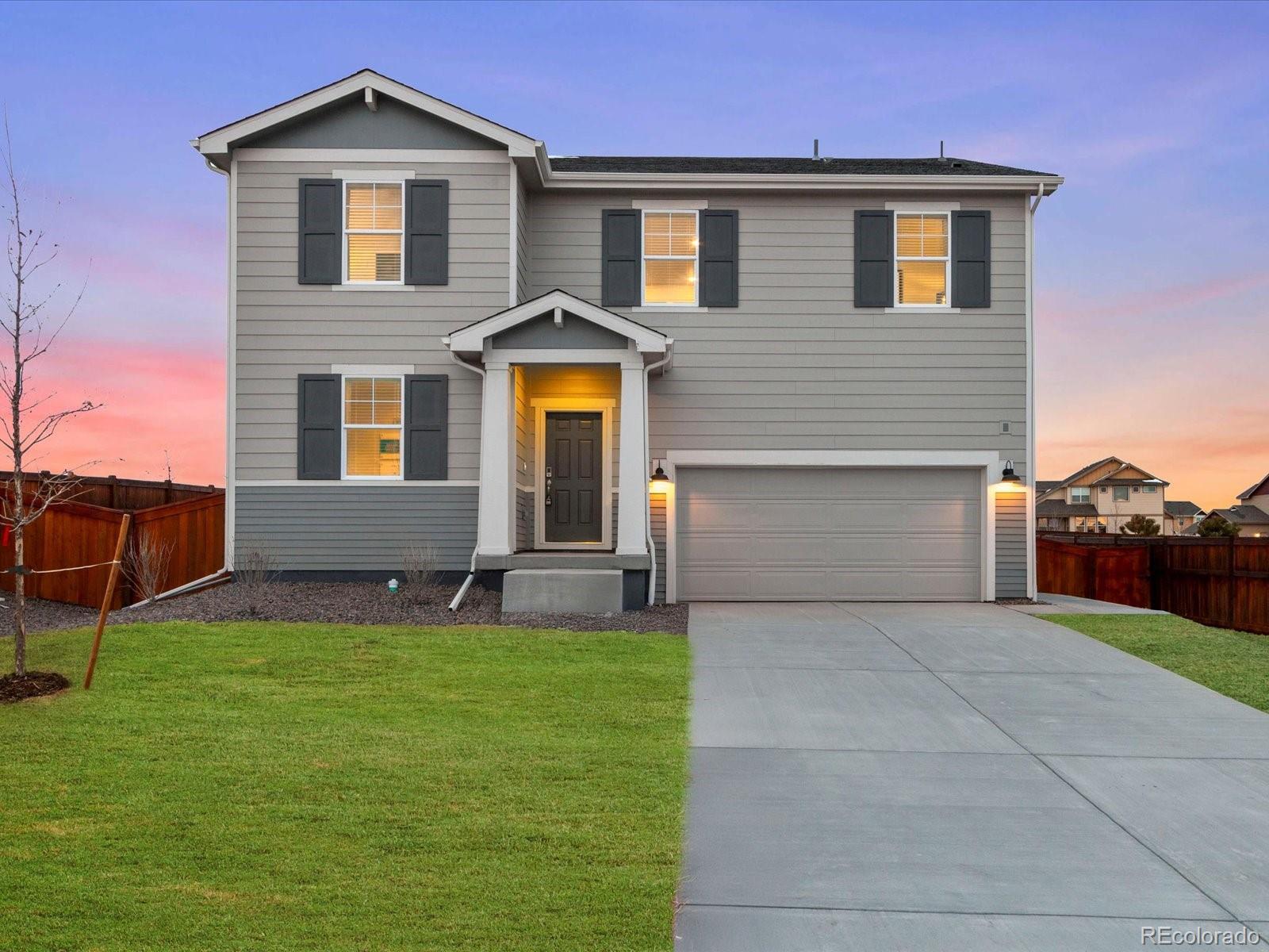 851 Frst Cyn Road Severance, CO 80550 - Photo 2 of 37 a front view of a house with a yard and garage
