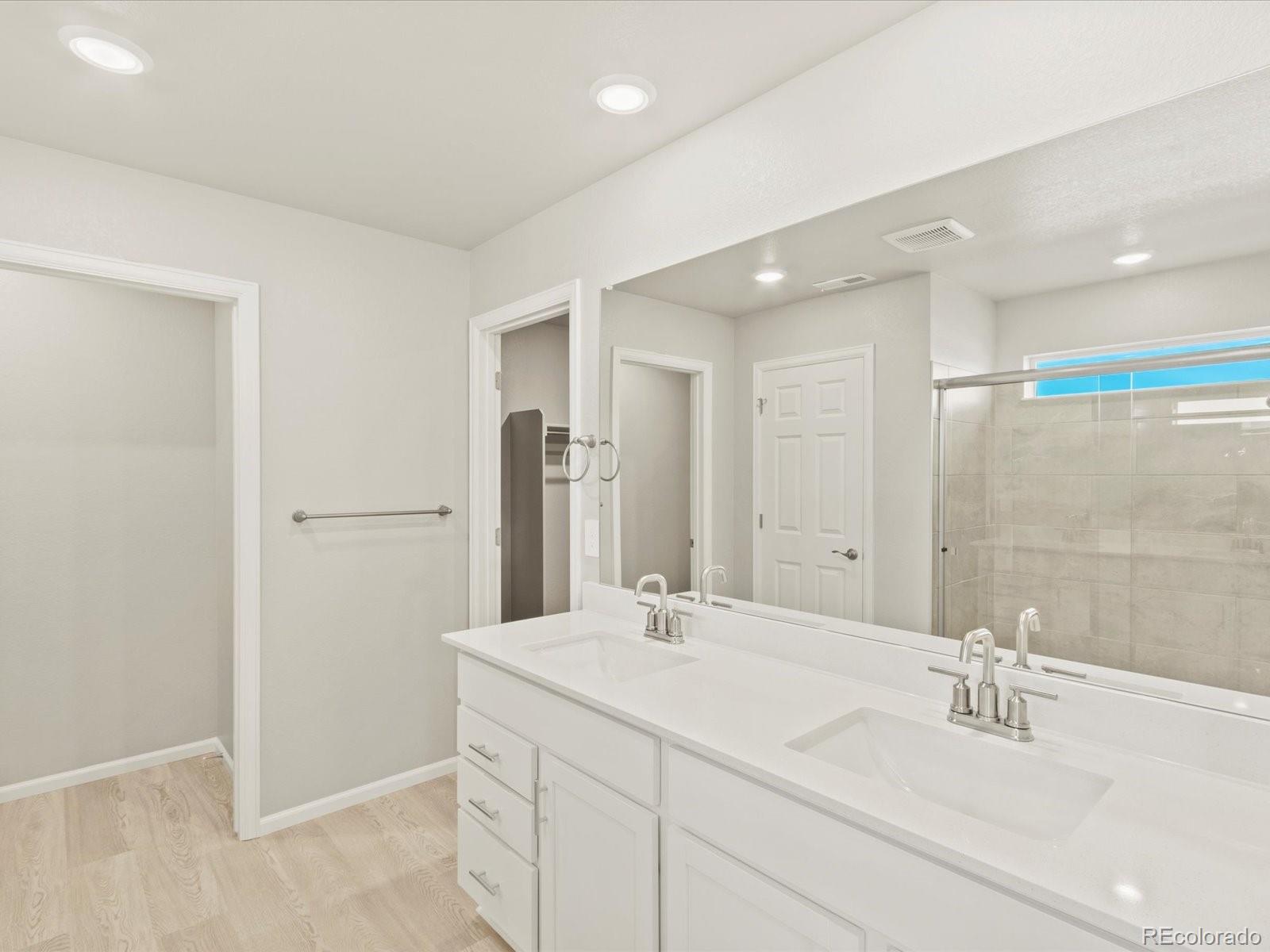 851 Frst Cyn Road Severance, CO 80550 - Photo 21 of 37 a bathroom with a sink and a mirror