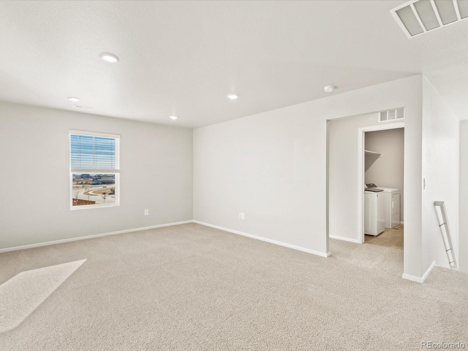 851 Frst Cyn Road Severance, CO 80550 - Photo 25 of 37 an empty room with windows and closet