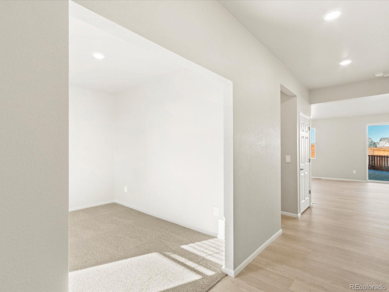 851 Frst Cyn Road Severance, CO 80550 - Photo 3 of 37 an empty room with wooden floor