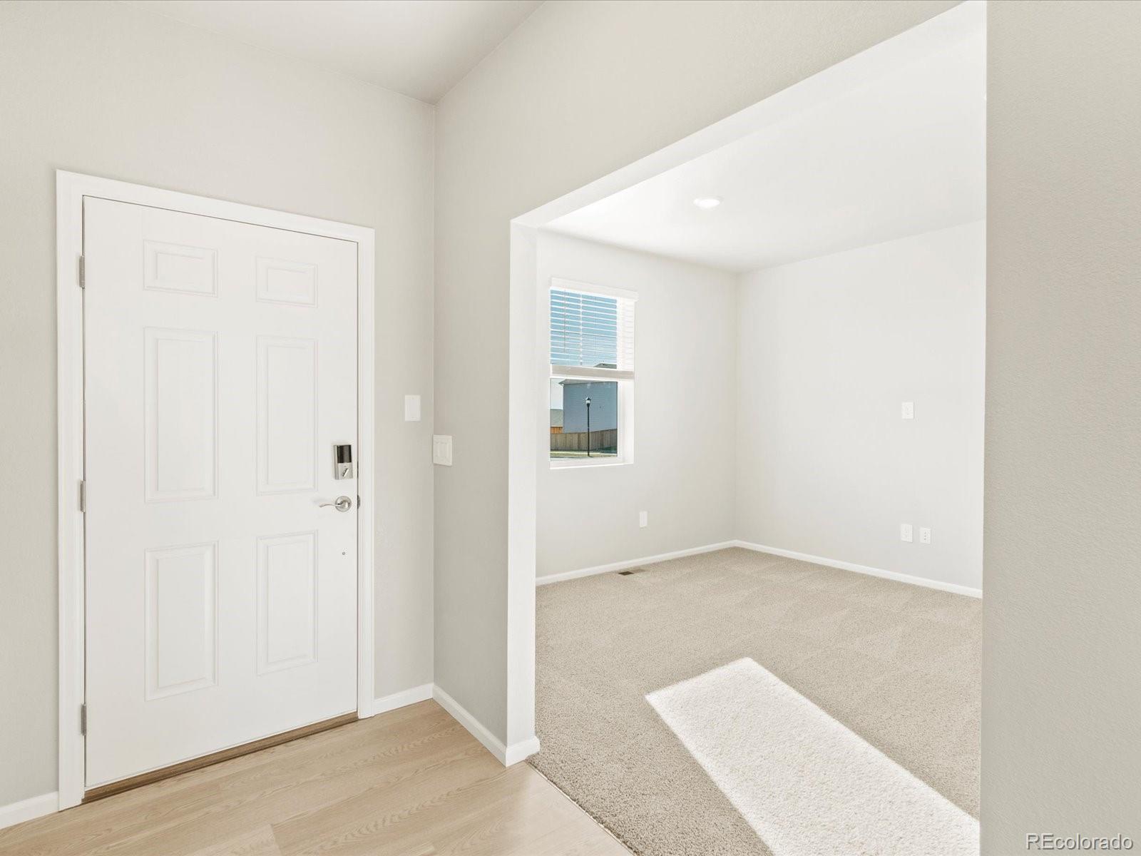 851 Frst Cyn Road Severance, CO 80550 - Photo 4 of 37 an empty room with windows