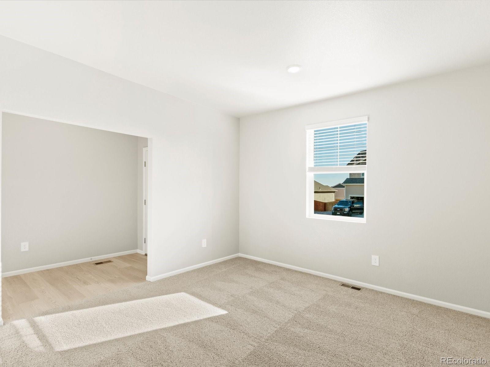 851 Frst Cyn Road Severance, CO 80550 - Photo 6 of 37 an empty room with windows