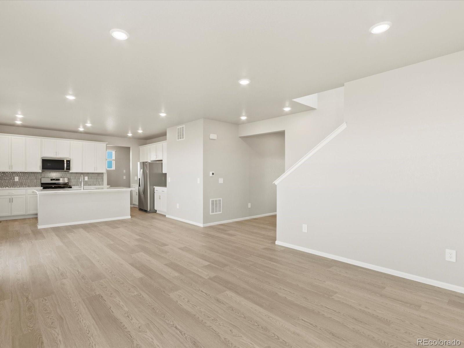 851 Frst Cyn Road Severance, CO 80550 - Photo 10 of 37 a view of kitchen with kitchen island and stainless steel appliances