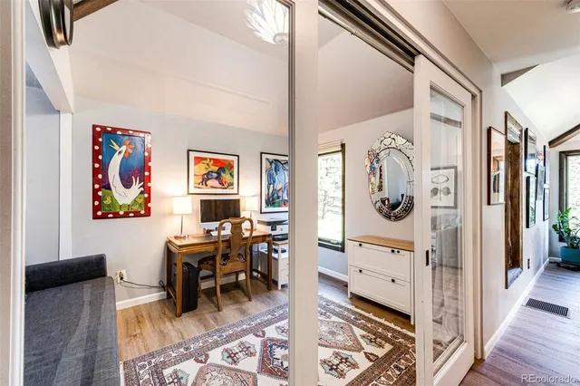 a view of a livingroom with workspace and a couch