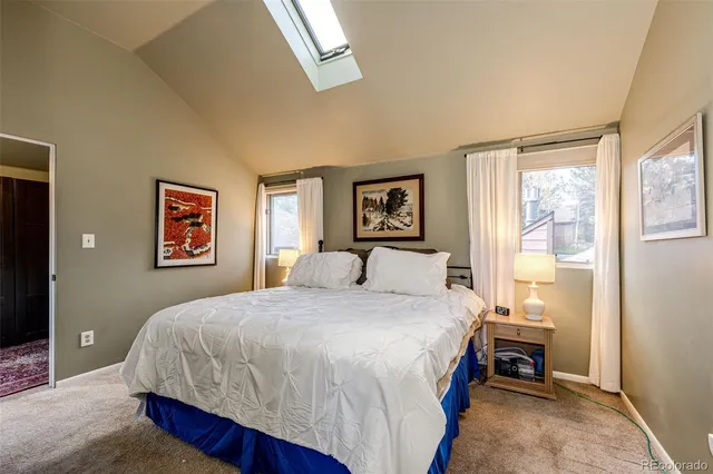 a bathroom with double sink and a mirror