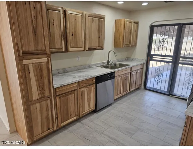 a view of a kitchen with windows