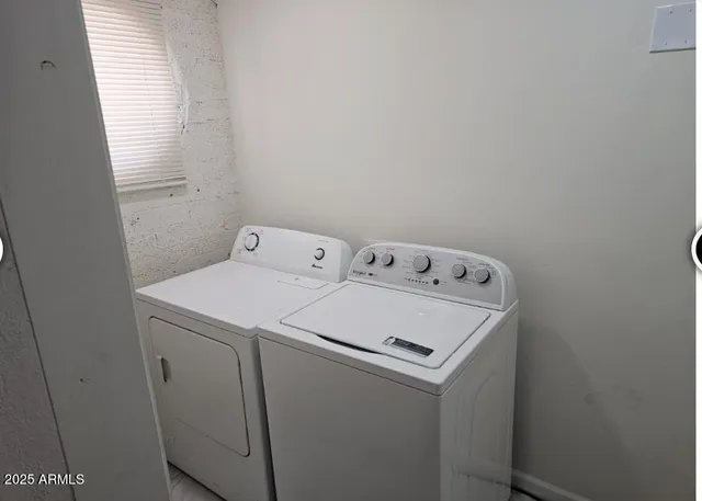 a utility room with dryer and washer