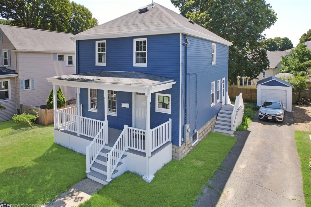 a front view of house with yard and green space