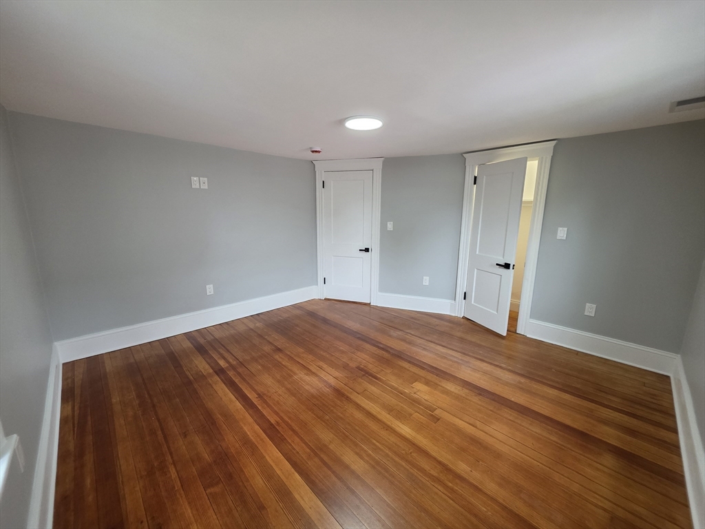 61 Poplar Street Danvers, MA 01923 - Photo 12 of 18 a view of empty room with wooden floor