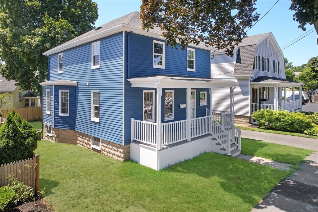 61 Poplar Street Danvers, MA 01923 - Photo 15 of 18 a view of a house with a yard plants and large tree