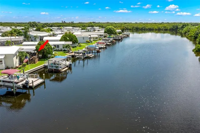 a view of a lake with boats and trees