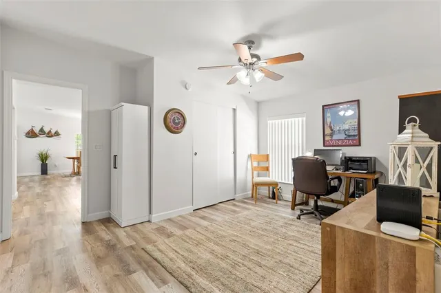 a bedroom with a workspace