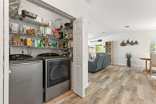 a kitchen with stainless steel appliances granite countertop a refrigerator and a stove