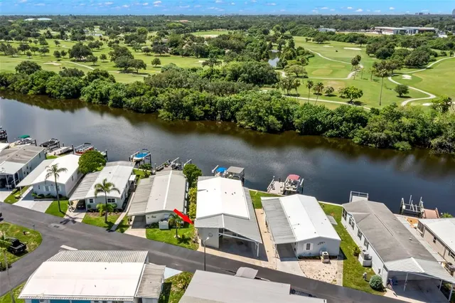 an aerial view of a house with a lake view