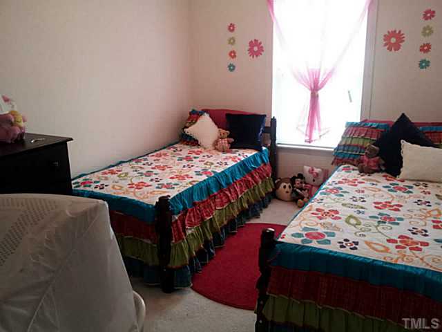 2052 Buffalo Way Durham, NC 27704 - Photo 11 of 20 a bedroom with two beds and a chandelier